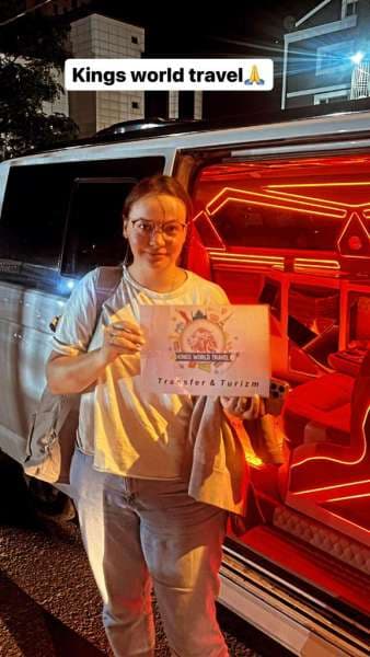 Customer with Night Kings World Transfer Sign